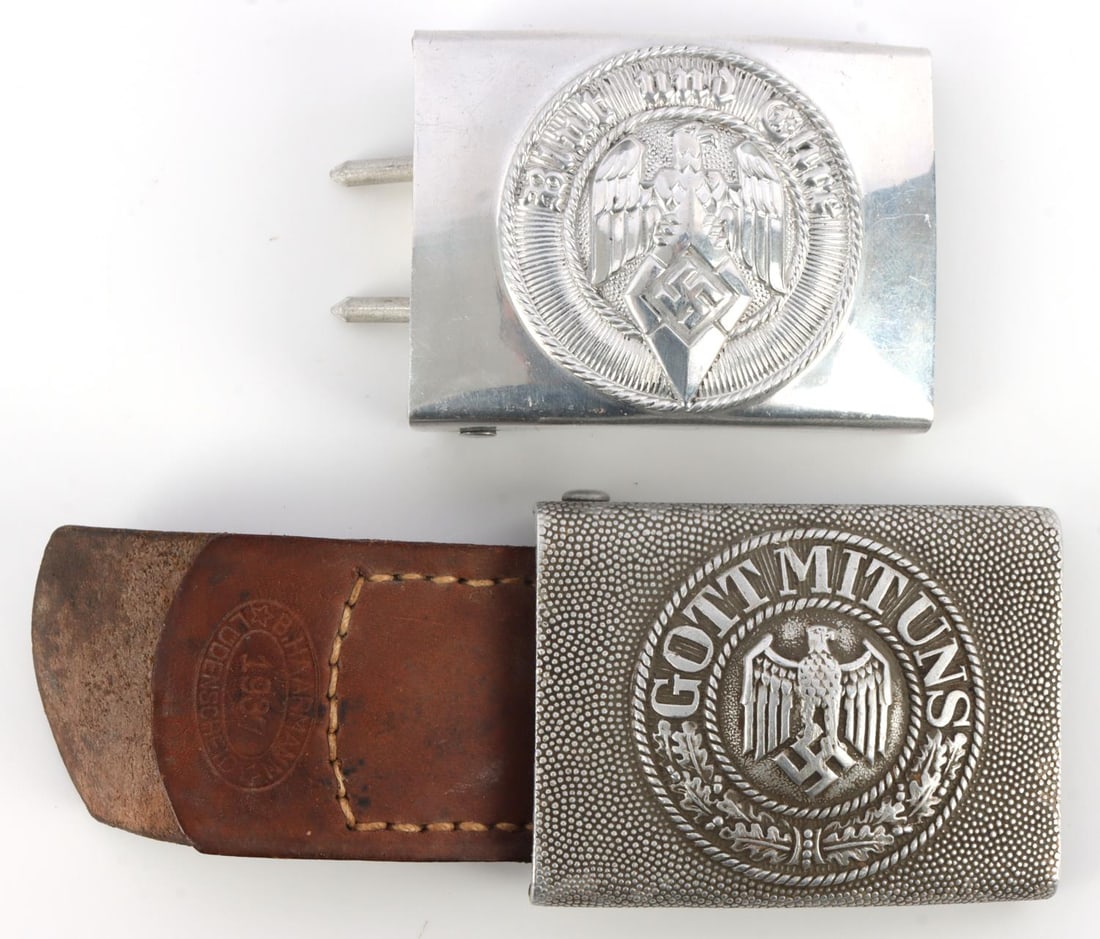 WWII GERMAN HITLER YOUTH & WEHRMACHT BELT BUCKLES: Th HJ has original tag in place. RZM stamped. Wehrmacht is dated 1937 on leather. Both in very good, original condition. This lot has a reserve.
