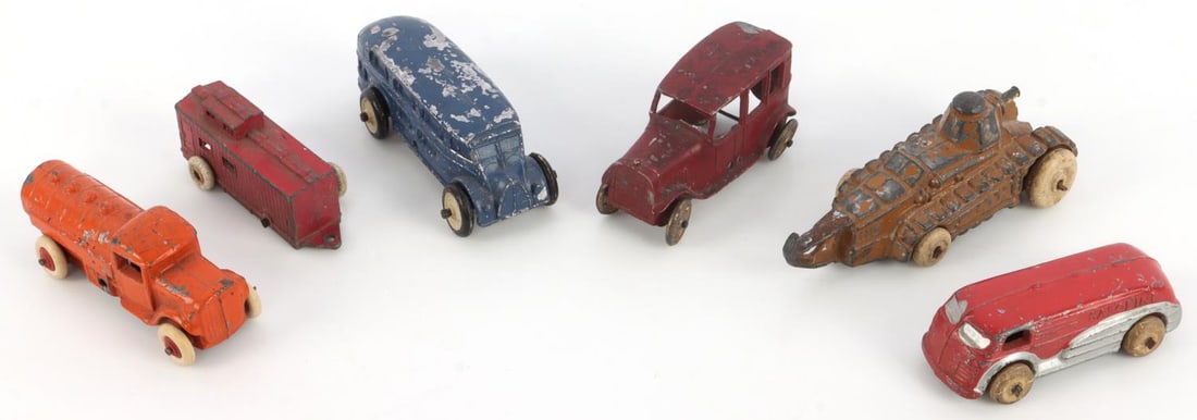 BARCLAY SLUSH METAL VEHICLE TOY CARS ARTILLERY VAN: Lot of several slush metal toys from Barclay. A red van with 'Gasoline' written on the side; a mobile artillery model; a blue van; a red train car, missing one wheel; an orange truck; a red station wa