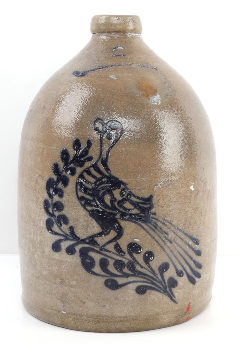 W ROBERTS BINGHAMTON TWO GALLON CROCK: Two-gallon crock showing a bird inlaid in blue on a brown-gray background. Stamped 'W. Roberts Binghamton.' 13.5 inches tall, 10-inch diameter.