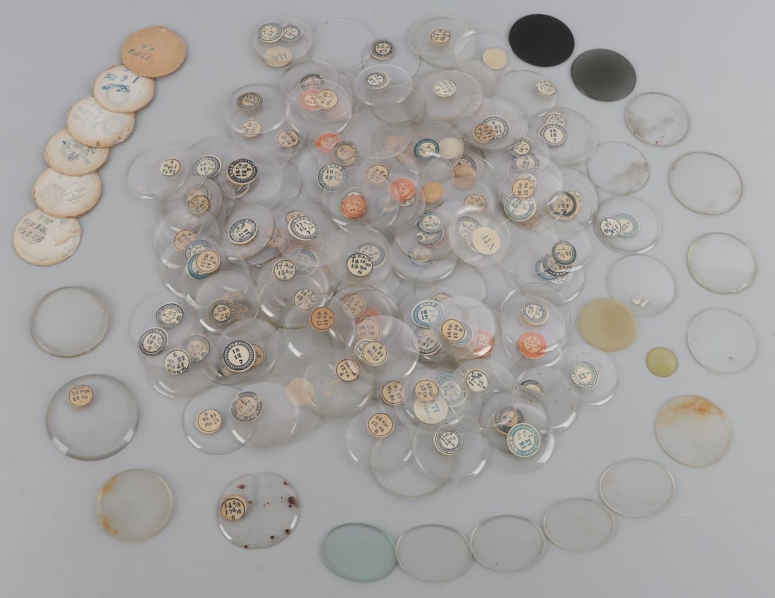 ANTIQUE CIGAR BOX FULL OF WATCH CRYSTALS: As photographed. All glass, none are plastic. Most are size tagged. Weight: john rack