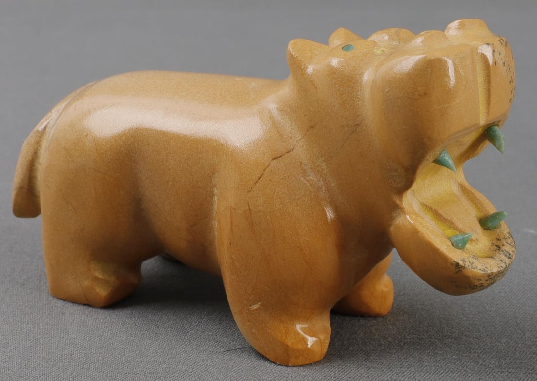 NATIVE ZUNI ANIMAL FETISH HIPPOPOTAMUS SIGNED: Zuni animal fetish depicting a hippopotamus carved from travertine. Signed on bottom 'EL' for Zuni carver Enrike Leekya. 3 inches. Very good, original condition.