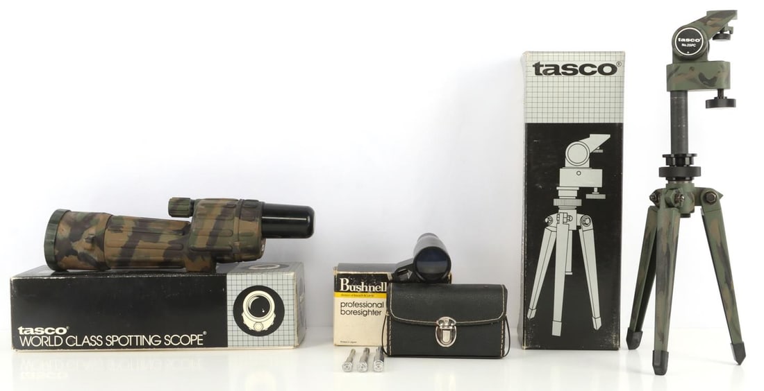 TASCO TRIPOD SPOTTING SCOPE & BUSHNELL BORESIGHTER: Lot of THREE (3) pieces. Tasco 25TC 25X60mm spotting scope, 25PC tripod and Bushnell 74-30002 professional boresighter. All three are in original packaging. Good condition.