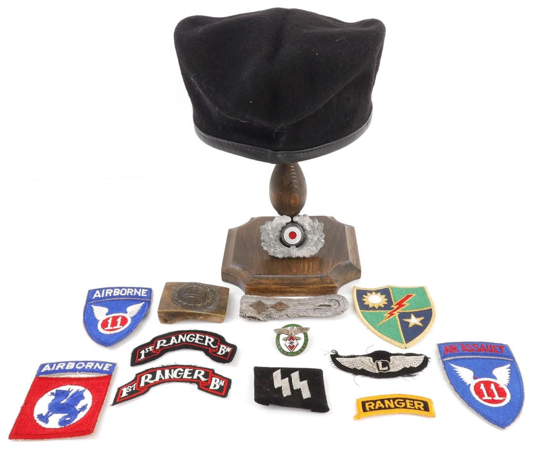 14 PCS WWI WWII VIETNAM MILITARIA VARIETY LOT: Lot of FOURTEEN (14) pieces assorted militaria. Includes WWI Imperial German brass uniform belt buckle, Spanish military Modelo de Boina black beret (size 56), group of eight (8) US uniform patches, T