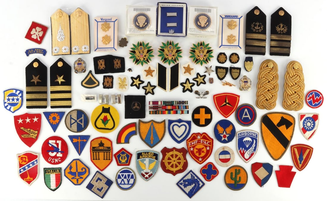WWII COLD WAR ASSORTED US PATCH BADGE PIN LOT: Includes 6 US Navy Shoulder Patches, 2 Thai Shoulder Patches, 20 US Patches, 60 WWII US Pins and Badges. Very good condition. Unauthenticated, sold as is.