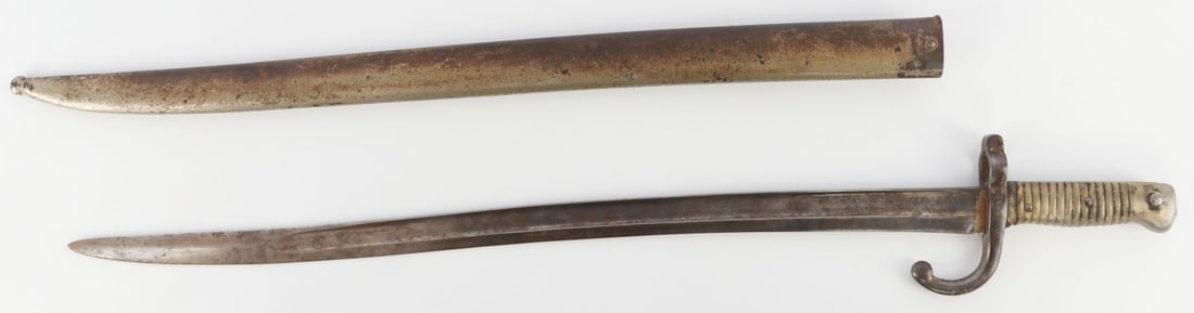 FRENCH M1866 CHASSEPOT YATAGHAN BAYONET & SCABBARD: French M1866 Yataghan bayonet with scabbard. Blade 22.5 inches. Unusual nickel plate finish. No arsenal marking on blade spine. Ricasso stamped with "S" in shield. Good condition.