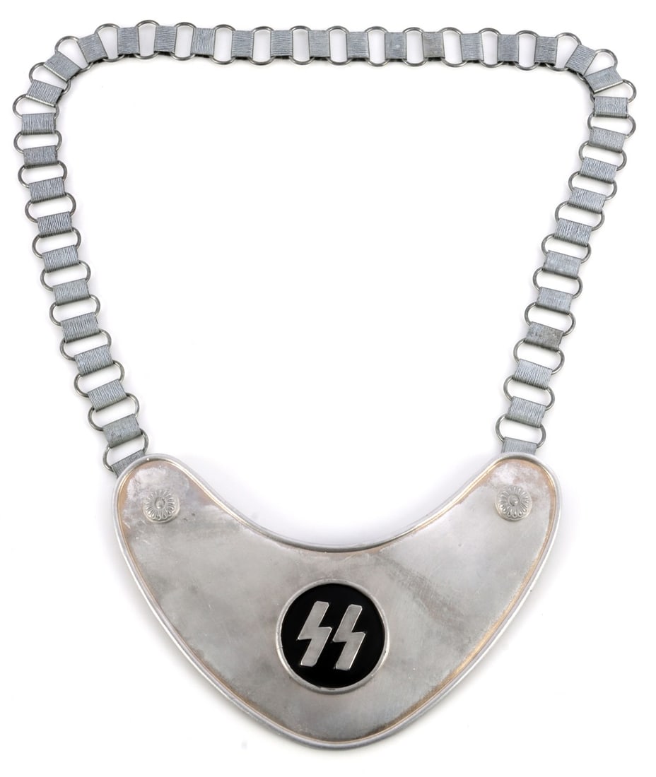 WWII GERMAN THIRD REICH SS FLAG BEARER GORGET: Standard bearer gorget for the SS. Displays SS Sieg-runes on a flat metal surface. Field gray cloth back. 'DRGM' stamped on prong. 6.5 X 4.25 inches. Unauthenticated, sold "as is."