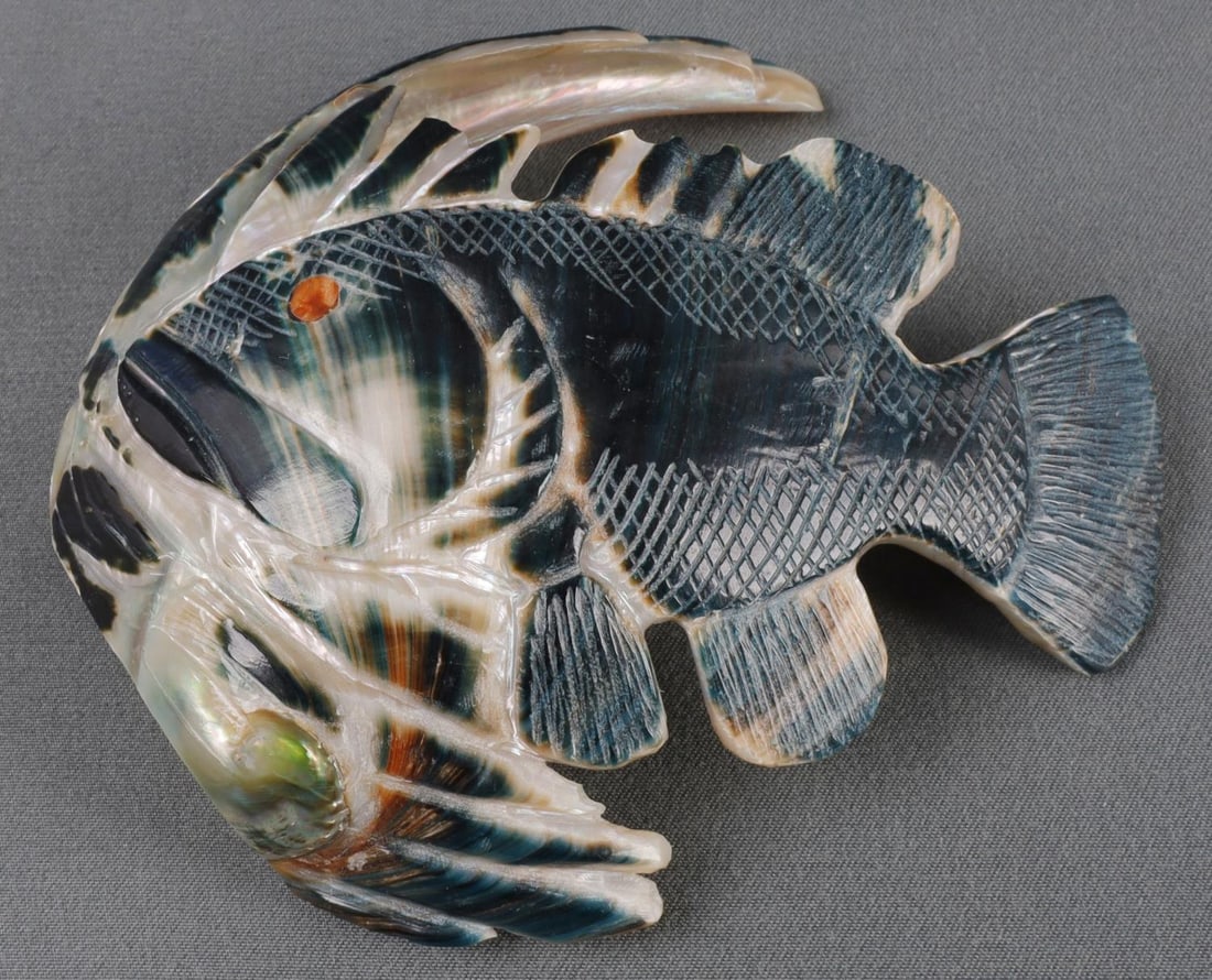NATIVE ZUNI ANIMAL FETISH FISH BY BRIAN YATSETTIE: Zuni animal fetish depicting a fish. Green abalone with coral insert. Underside has a mark indicating that it was created by Zuni artist Brian Yatsettie. 4.5 X 1.5 X 4 inches. Very good, original cond