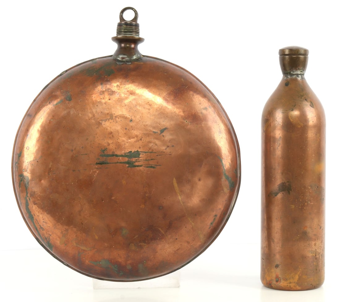 PAIR OF ANTIQUE COPPER HOT WATER CHEMICAL BOTTLES: Lot of TWO (2) pieces. Pair of heavy copper hot water bottles with caps. Taller bottle (11.5 inches) is insulated. The canteen bottle has a diameter of 11 inches. Gross weight: 4.31 pounds. Very good