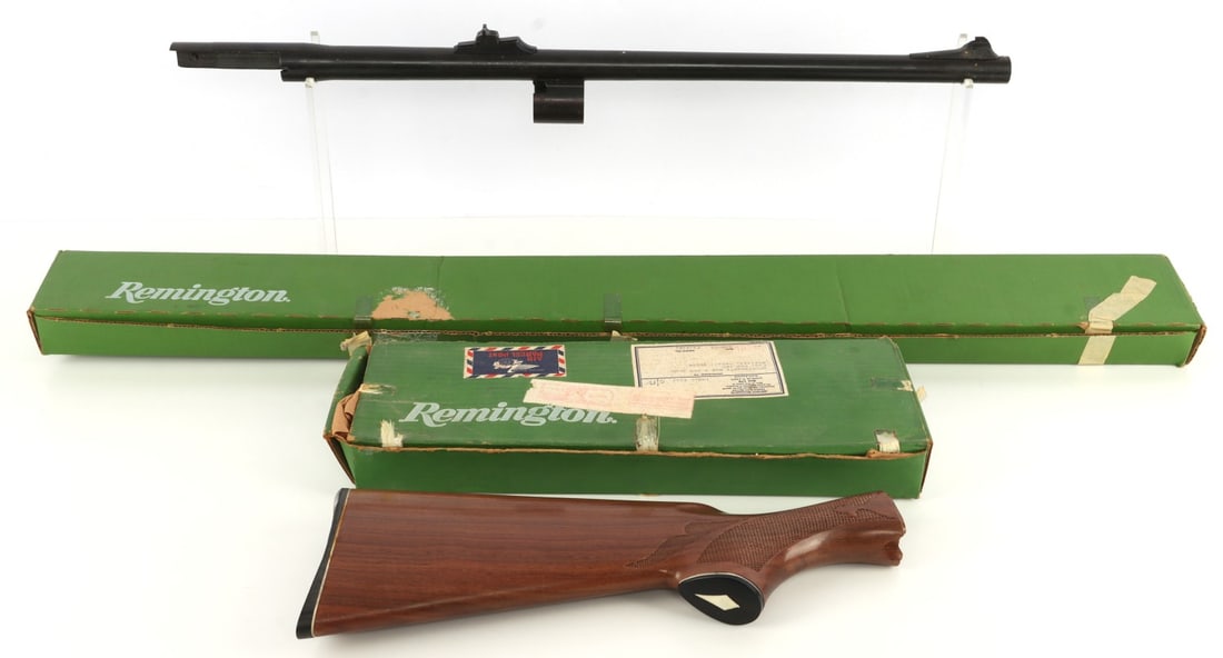 REMINGTON 1100 12 GA DEER SLUG BARREL & STOCK: Lot of TWO (2) pieces. Includes Remington 1100 smooth bore deer slug barrel. Blued steel, 12 gauge, 2.75-inch chamber, 22 inch length, improved cylinder choke and rifle sights. Also includes Remington