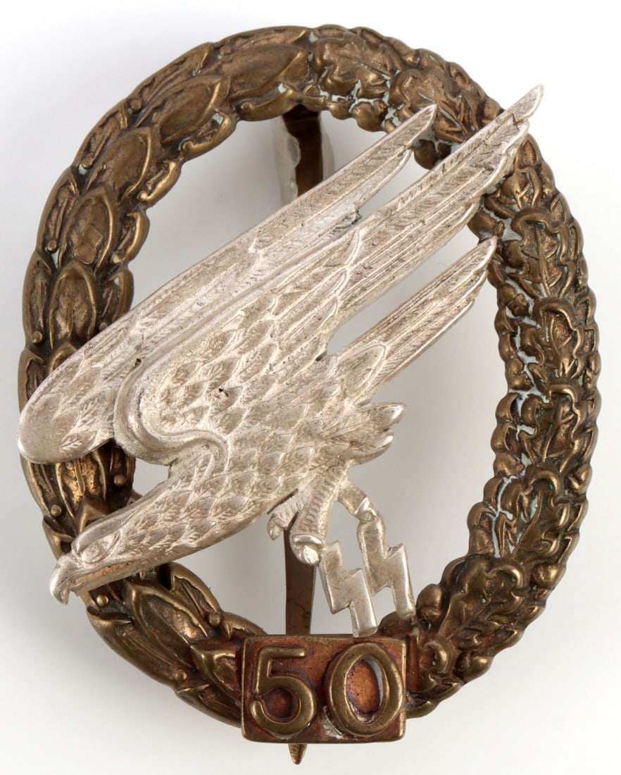 WWII GERMAN LUFTWAFFE PARATROOPER BADGE SS: Unusual SS paratrooper badge. Reverse engraved. 2 inches. Not likely period.