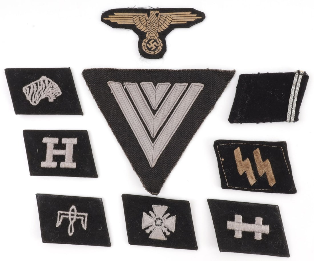WWII GERMAN SS INSIGNIA & COLLAR TAB LOT 9PCS: Lot of NINE (9) pieces includes SEVEN (7) collar tabs, ONE (1) sleeve eagle and ONE (1) rank chevron on HBT backing. Tabs representative of the Free India Legion as well as the 14th, 25th, 29th, and 3