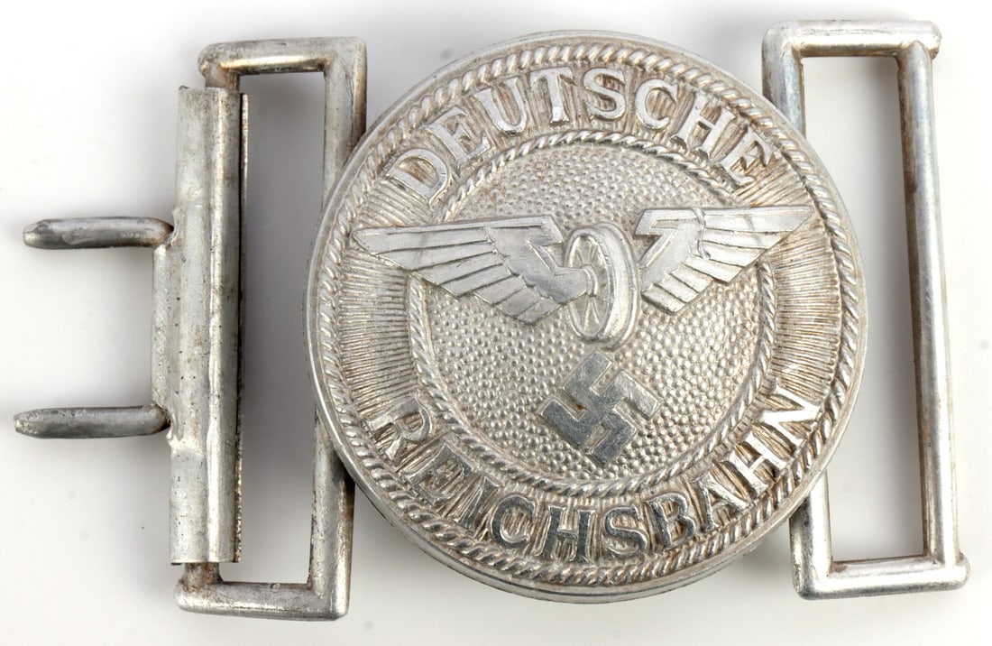 WWII GERMAN THIRD REICH REICHSBAHN BELT BUCKLE: Aluminum construction. DRGM and Assmann marked. 2.75 inches. Very good condition. This lot has a reserve.