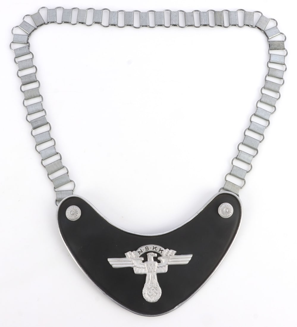 WWII GERMAN REICH NSKK STANDARD BEARER GORGET: Standard bearer gorget for the NSKK. Reichsadler on black paint and tin base. Chain is 26.5 inches. 7.5 X 4.5 inches. Unauthenticated, sold "as is."