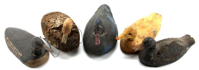 LOT OF FIVE VINTAGE DUCK DECOYS: Grouping of five vintage duck decoys. Sears paper mache "Life Like" duck decoy, damage to bill; cork decoy with wooden head, and anchor loop on bottom; cork add -a-wing decoy; hand carved raw pine dec