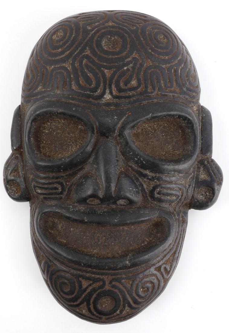 TAINO PRECOLUMBIAN EXPRESSIVE ANCESTER PORTRAIT: Taino Precolumbian large expressive ancestral portrait head. Heads like this were probably held during rituals celebrating ancestral heritage. Face is fully engraved with curvilinear designs and bird 