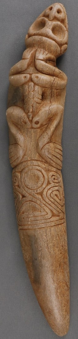 TAINO PRECOLUMBIAN ZOOMORPHIC DAGGER FORM: Taino Precolumbian elaborate zoomorphic dagger like form. The head has full dentition and nose nob similar to a crocodile. The nose nob also represents a bird head. The body is skeletal and the feet a