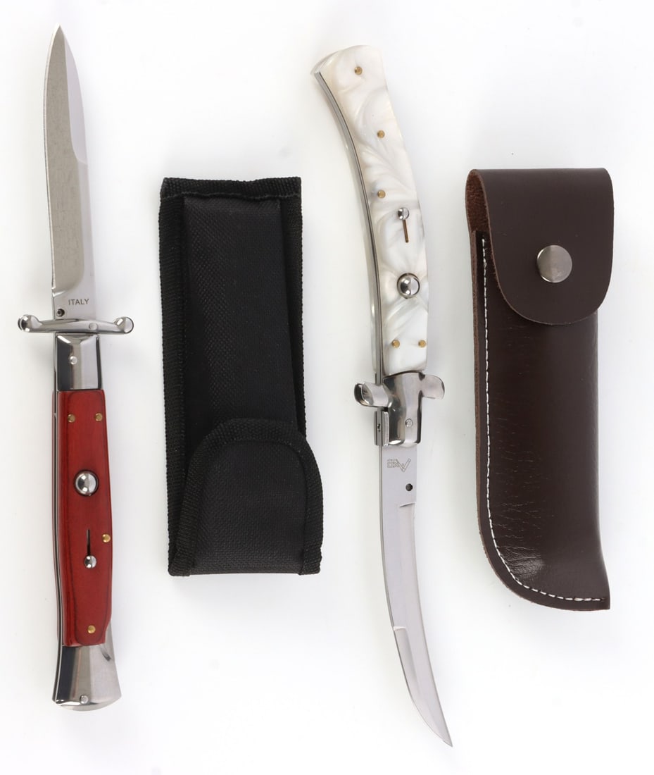 SWITCHBLADE LOT OF 2 AKC ITALY: Each with strong spring, one is stamped AKC the other Italy. With cases, each very good condition, 5 1/2 inches closed, 10 inches open.