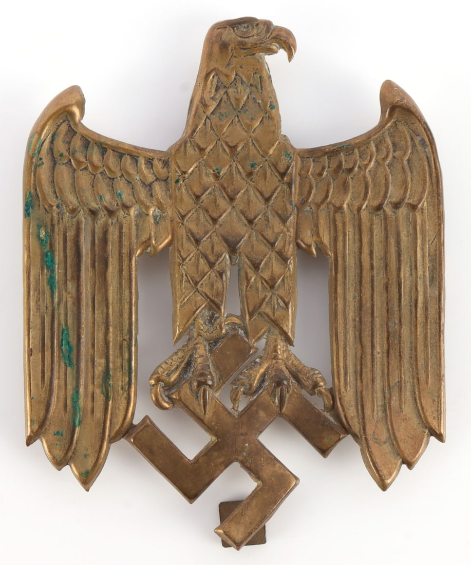 WWII GERMAN BRASS EMBLEM WEHRMACHT EAGLE: Brass, die-stamped eagle plate or plaque. Reverse is hollow, with four screw-posts. 3.75 X 3 inches. Very good condition. Some oxidation.