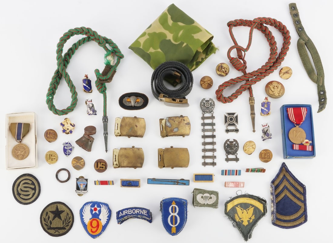 WWII 8TH INFANTRY VIETNAM 101ST AIRBORNE GROUPING: Lot of approximately SEVENTY (70 +/-) pieces. Collection of uniform insignia, DUI pins, patches and relics from the estate of a WWII 8th Infantry serviceman and his son, a member of the 101st Airborne