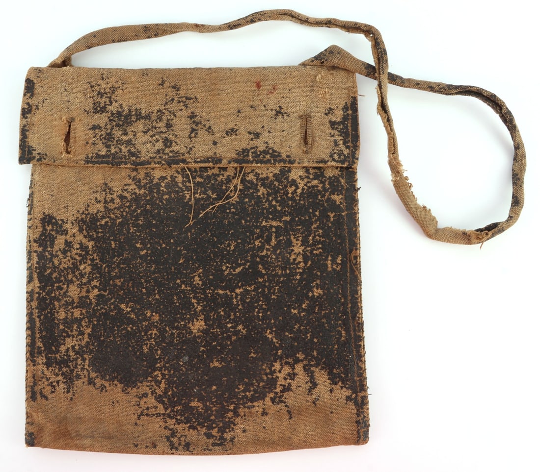 US CIVIL WAR RUBBERIZED CONFEDERATE HAVERSACK: Rubberized haversack for the Confederate States of America. Item shows remnants of how it was once fully covered by external material, is missing two buttons, and has a gash near bottom. Some fraying,