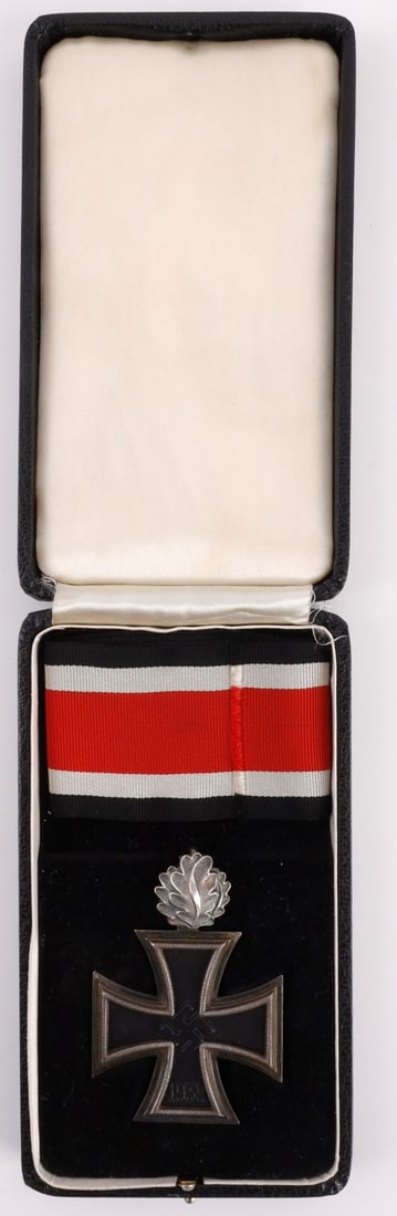 WWII GERMAN KNIGHTS CROSS OF THE IRON CROSS: By C.E. Junker, .800 and lazy 2 marked. Iron magnetic core. Oak leaves stamped .900 and 21 for firm of Godet, Berlin. Includes non-fluorescing ribbon and case. This lot has a reserve.