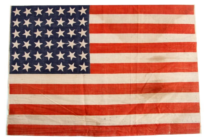 1869 42 STAR UNITED STATES FLAG 17X12: Some light staining but free of holes and tears, in a glass and wood frame.