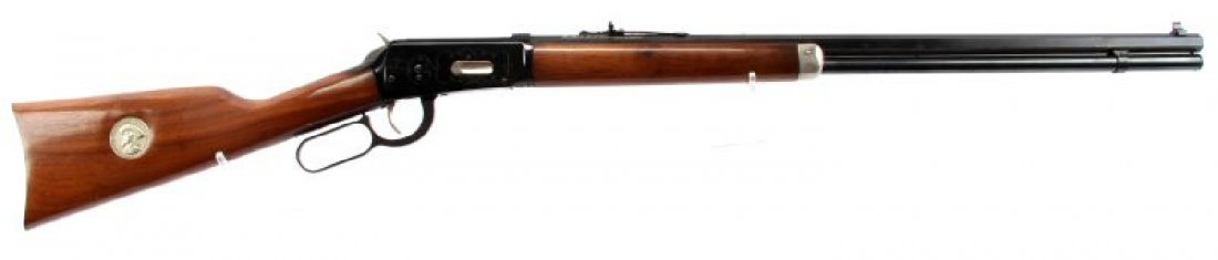 WINCHESTER MODEL 94 BUFFALO BILL COMMEMORATIVE: Winchester Commemorative Model 94, 30-30, "Buffalo Bill" saddle ring carbine. 20 inch octagon barrel, high gloss blue finish, engraving on both sides of receiver, adjustable rear sight, nice walnut wo
