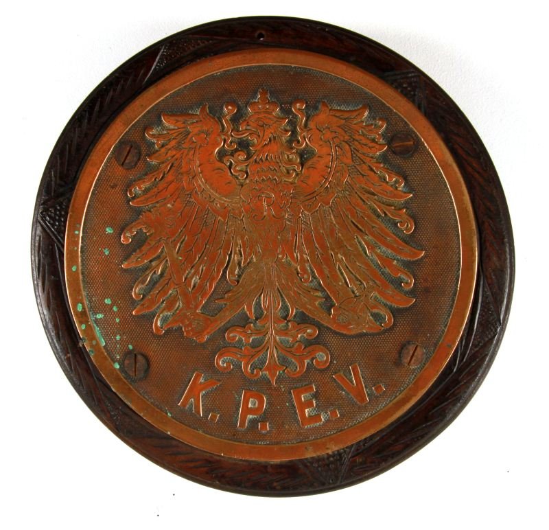 GERMAN IMPERIAL KPEV RAILWAY PLAQUE: Königlich Preußische Eisenbahn-Verwaltung (Royal Prussian Railway Administration) copper-alloy plaque with the Prussian Eagle mounted on carved wood. Plaque measures approximately 9.75 inches in dia