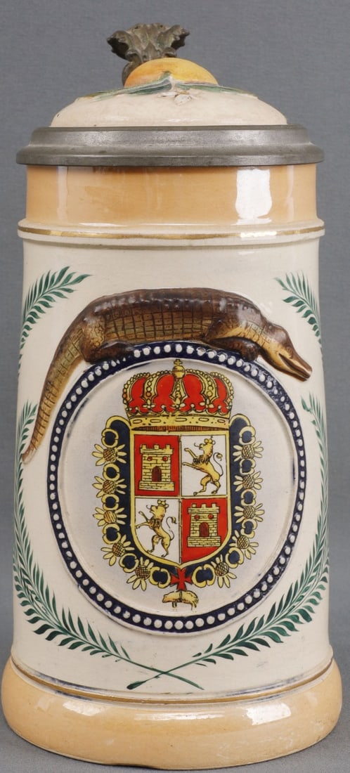 VICTORIAN ALLIGATOR HANDLE STEIN SPANISH FLORIDA: Alligator-handle glazed ceramic stein, antique souvenir of Florida with painted decoration and St. Augustine heraldic crest. Underside stamped "J.G." Height 8 inches. Very good condition. This lot has