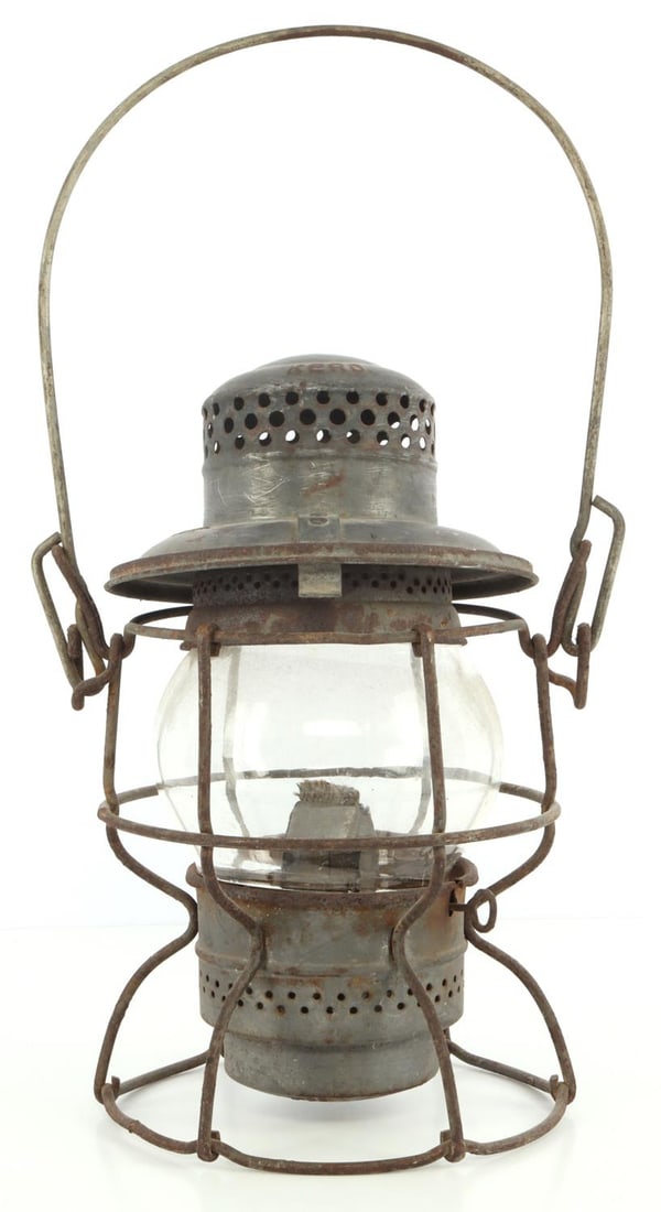 VINTAGE ADLAKE KEROSENE RAILWAY LANTERN: Vintage kerosene rail lantern from Adlake. Iron and glass construction. 9.5 inches tall, 6-inch radius.