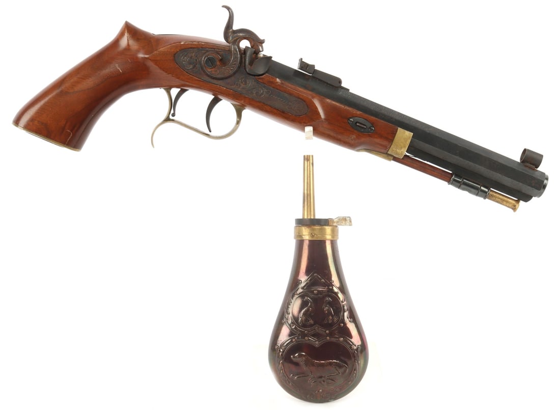 THOMPSON CENTER PATRIOT .45 BLACK POWDER PISTOL: Thompson Center Patriot .45 cal muzzle loading black powder pistol with powder flask. Blued octagonal barrel, rifled bore, wood stock. Fair condition. Hammer does not hold back. Missing rear tang scre