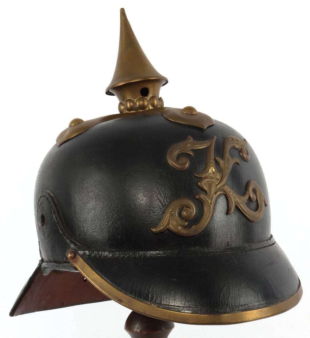WWI IMPERIAL GERMAN MUNICIPAL PICKELHAUBE HELMET: Black leather with brass accoutrements, K in front for Koln and an indication that the helmet was worn by a Municipal Officer, wearable size 7 3/8. Without liner. Otherwise, very good, original condit