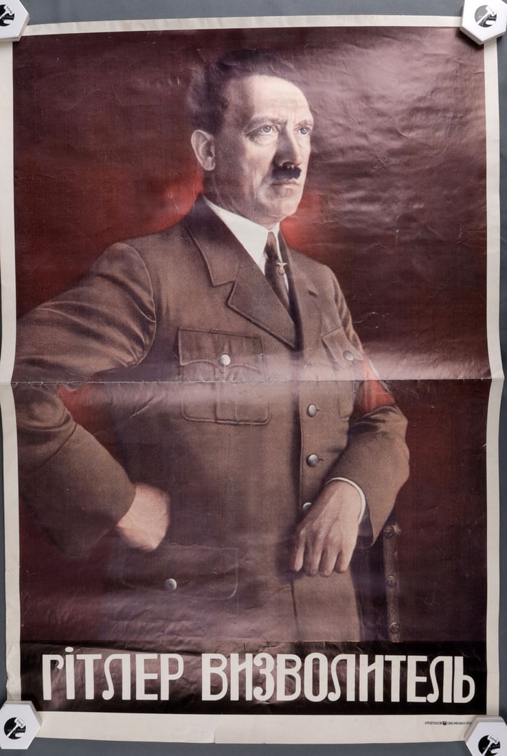 WWII GERMAN THIRD REICH HITLER POSTER IN UKRAINIAN: Poster showing the likeness of Adolf Hitler. Under the image, in Ukrainian, poster reads 'Hitler - Liberator.' 23 X 33 inches. Unauthenticated, sold "as is."