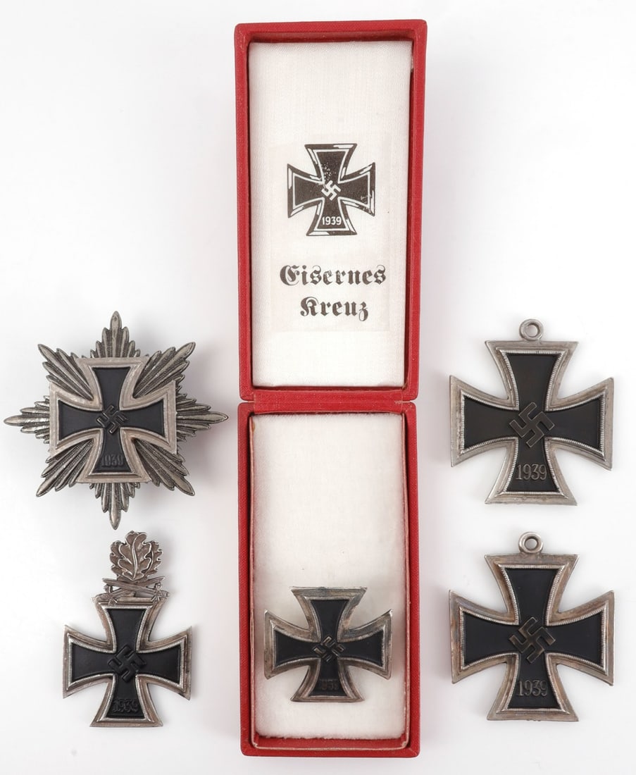 LOT OF 5 WWII GERMAN THIRD REICH IRON CROSSES: Lot of FIVE (5). 1) Iron Cross First Class in presentation box. 2) Knight's Cross with Oak Leaves and Swords. 3) Grand Cross. 4) Grand Cross. 5) Grand Cross breast star. All unauthenticated, sold "as