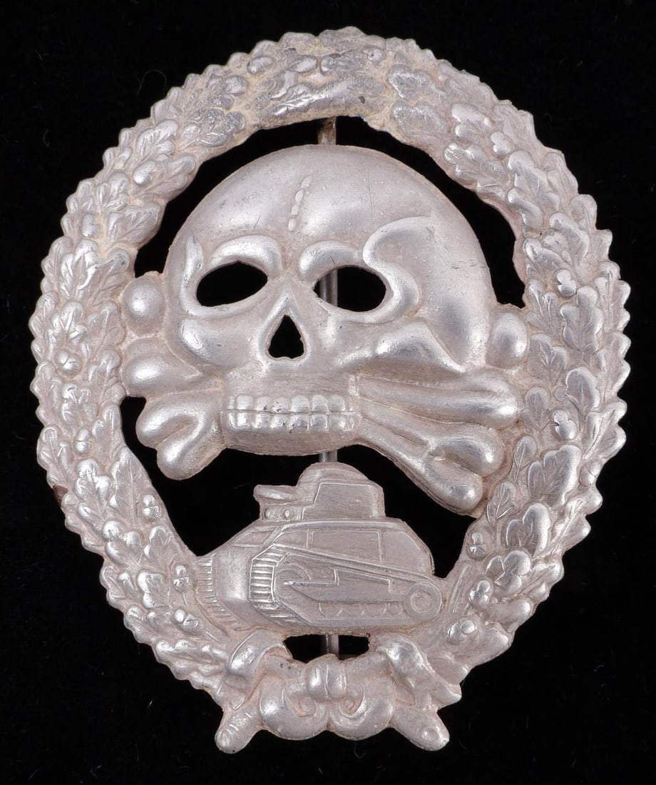 WWII SPANISH CONDOR LEGION WAR TANK BADGE: Hollow type with cut outs. 2 1/8 inches. Very good condition. Unauthenticated sold As-Is This lot has a reserve.