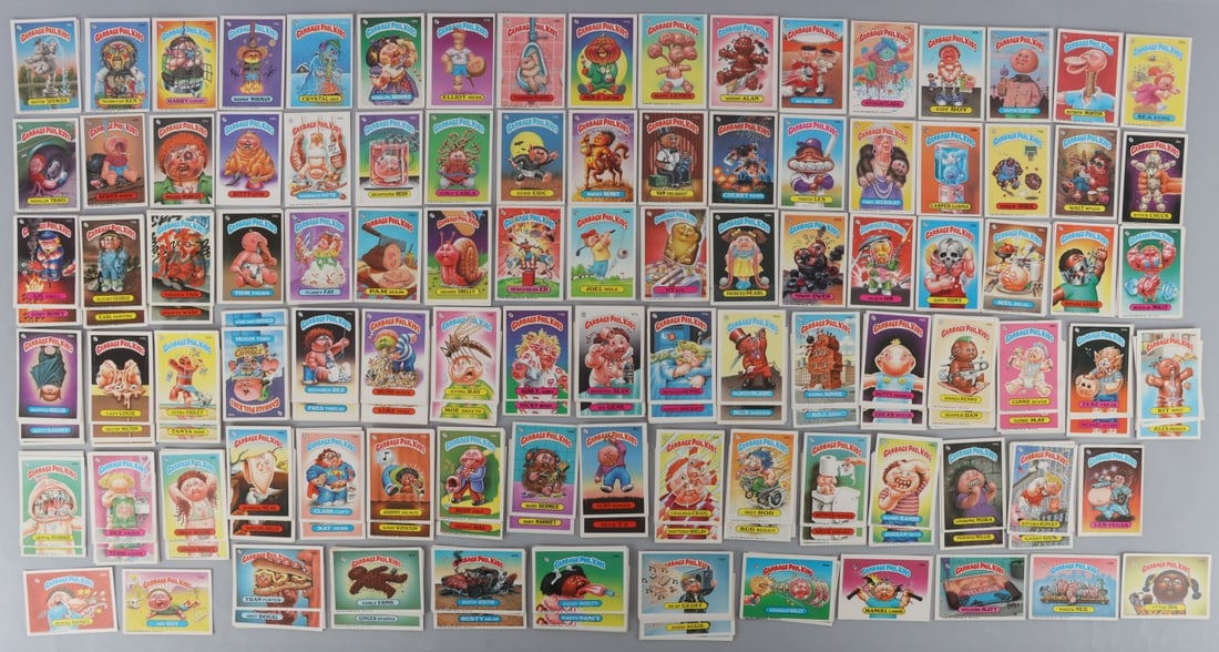 300 ORIGINAL 1986 GARBAGE PAIL KIDS TRADING CARDS: Lot of THREE HUNDRED (300) vintage Garbage Pail Kids trading cards from 1986. Partial set. Includes: Stuck Chuck, Zeke Freak, Gory Rory, Connie Sewer, Lucas Mucus, Bud Buggy, Deaf Geoff, Dee Faced, an