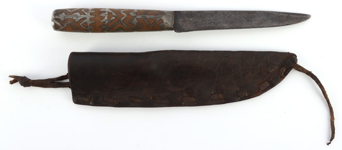 FUR TRADE KNIFE WITH SILVER INLAY HANDLE: Fur trade knife with silver inlay handle and leather scabbard. Age, wear, and construction on knife and scabbard strongly indicate a nineteenth or late eighteenth century construction. More likely Nat