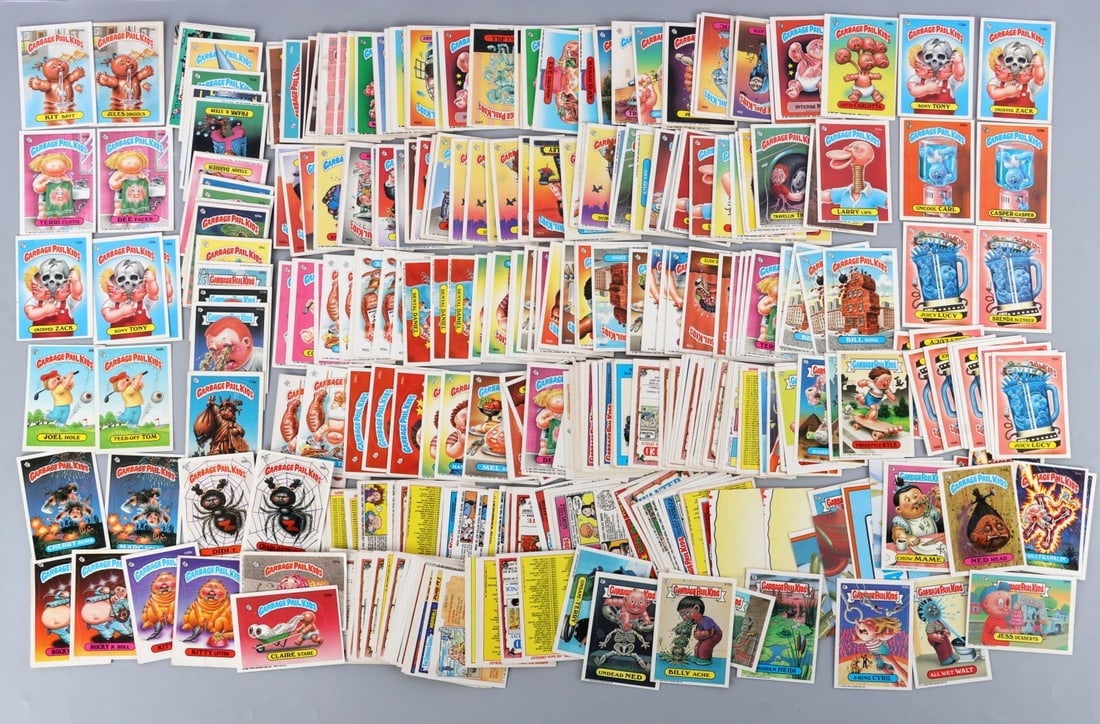 340 ORIGINAL 1986 & 1988 GARBAGE PAIL KIDS CARDS: Lot of THREE HUNDRED AND FORTY (340) vintage Garbage Pail Kids trading cards includes both 1986 (286 cards) and 1988 (54 cards). Partial set. Cards include: Jayne Drain, Bloody Murray, Seymour Barf, G