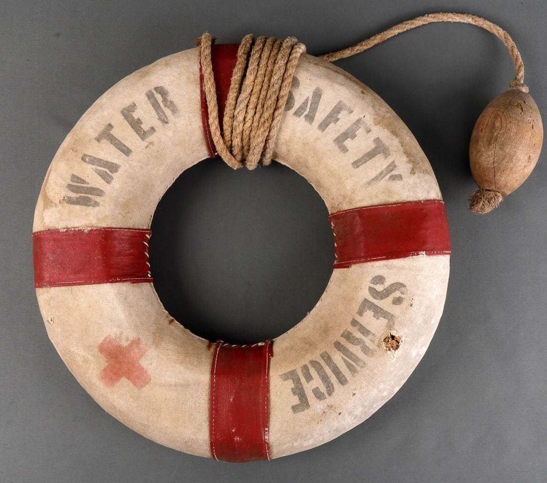 WATER SAFETY SERVICE ANTIQUE LIFE RING: Some age staining, printed both sides with Red Cross. Very good, original condition.