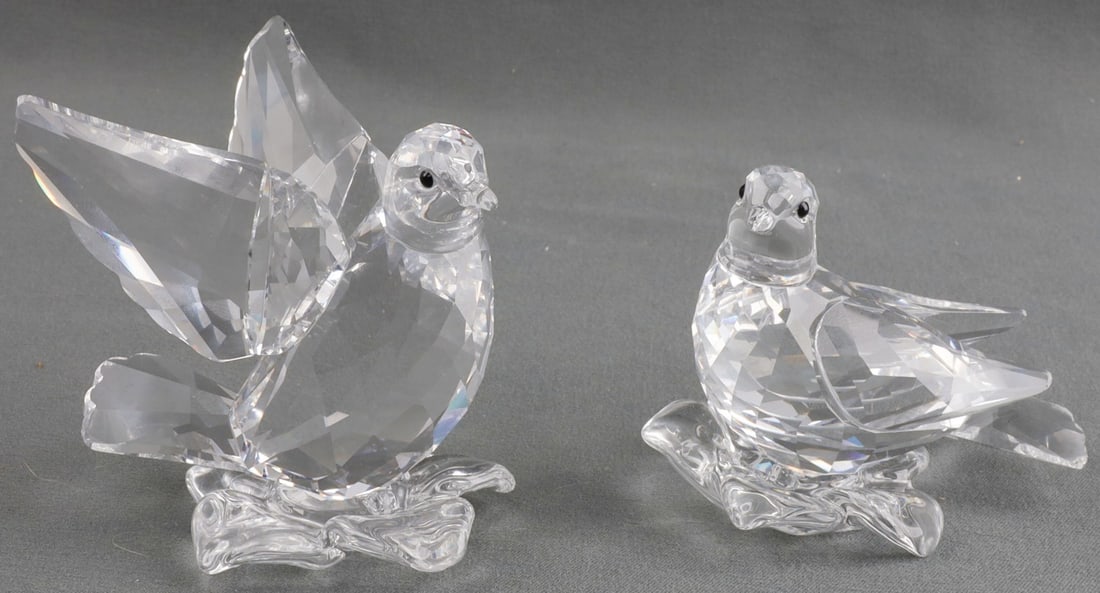 SWAROVSKI CRYSTAL TURTLEDOVES: Pair of Swarovski crystal turtledoves, male and female. Male figure is 2.5 X 2.5 X 2 inches, female is 3 X 2 X 1.75 inches. In original case. Very good, original condition. This lot has a reserve.