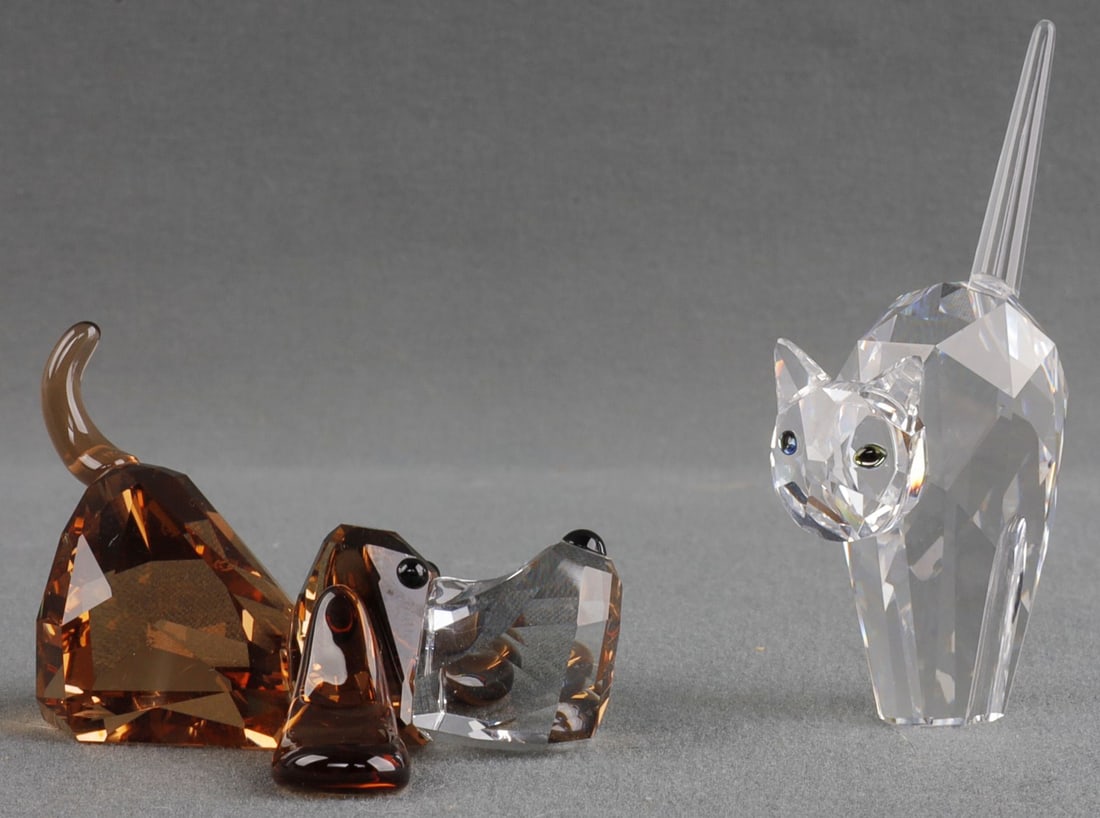 LOT OF 2 SWAROVSKI CRYSTAL ANIMALS PEPPINO & TOMCA: Lot of TWO (2) Swarovski crystal animals. 1) "Peppino", a lazing dog from the Lovelots collection. 2) "Tomcat", a figure showing a scared or aggressive cat. Both are in their original box. Boxes are b
