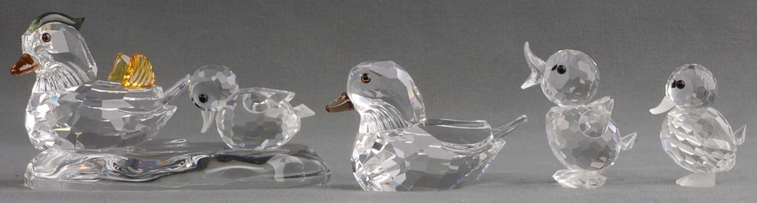 LOT OF 4 SWAROVSKI CRYSTAL DUCK FIGURINES: Collection of FOUR (4) animal figures by Swarovski Crystal. 1) Mandarin ducks. 2) Miniature Drake Standing. 3) Standing duck. 4) Mini duck swimming. All are in their original case. All are very good, 