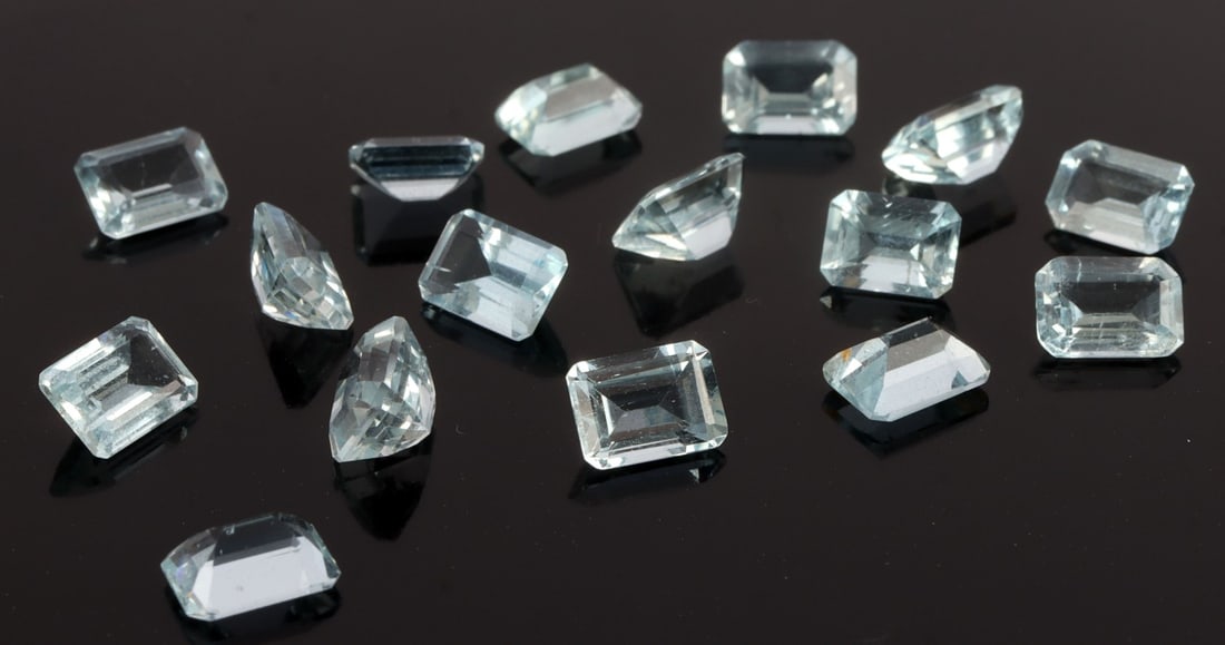 14.5 CARATS OF LOOSE CUT AQUAMARINE BERYL: Cut aquamarines weighing in at a total of 14.5 carats. Emerald cut. Eye clean. Stones could be considered very light to light in terms of color. Very good, "like new" condition. Approx. 6 X 2.5 X 4 mm
