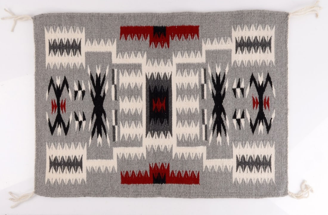 NATIVE AMERICAN NAVAJO RUG STORM DESIGN BY LEE: A Navajo rug displaying the 'storm' pattern, a strong geometric creation in black, white, dark brown, and red. Woven by Navajo weaver Hubieanna Lee and comes with a receipt showing her name. Provenanc