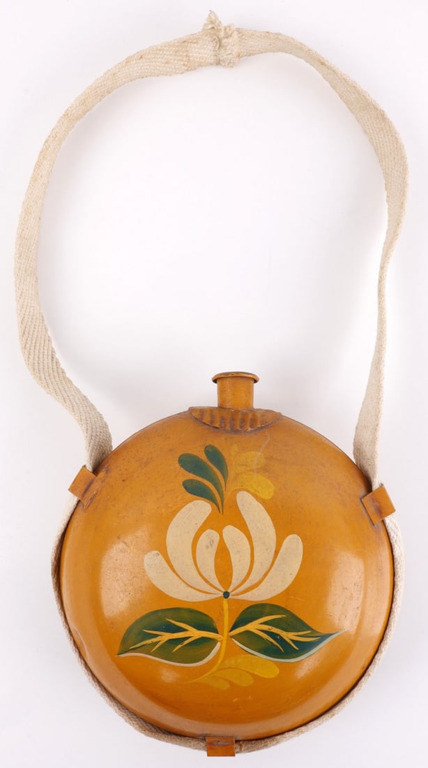 US CIVIL WAR CONFEDERATE MAGNOLIA CANTEEN: A Confederate-style canteen that has been modified with orange paint and a stylized depiction of a flower, likely a magnolia. Paint shows evidence of being old, likely nineteenth or very early twentie
