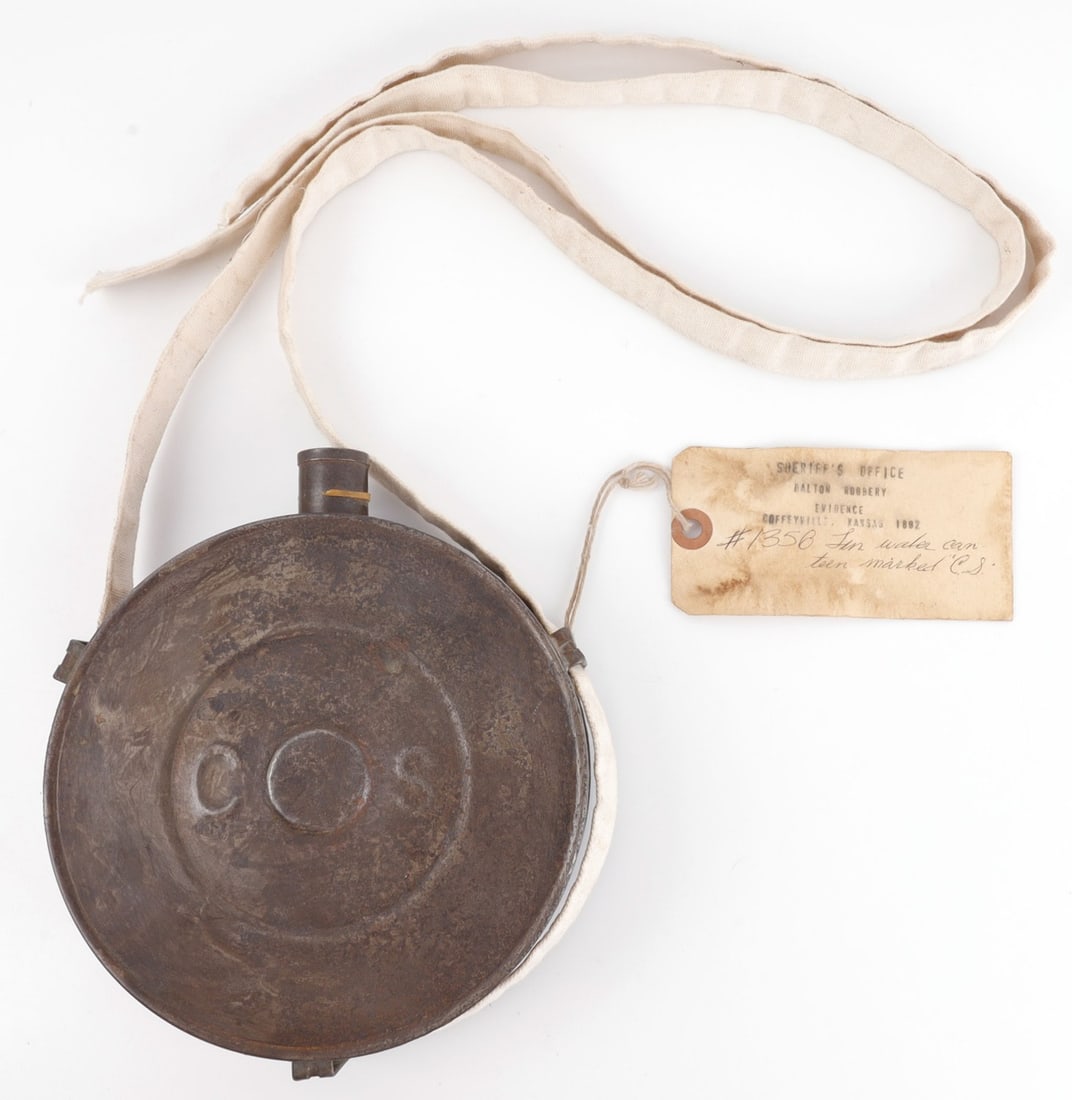 US DALTON GANG CANTEEN COFFEYVILLE ROBBERY: Bullseye canteen from the late 19th century, with cloth supporting straps. Straps are likely newer than the canteen. Attached to the canteen is a ticket reading "Sheriff's Office Dalton Robbery Eviden