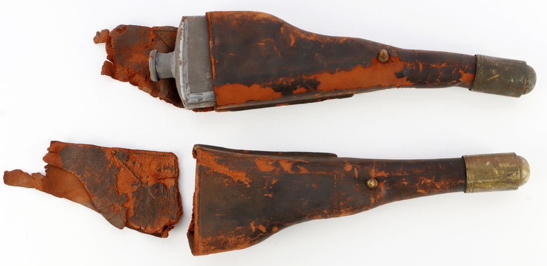 US SADDLE CANTEEN HOLSTERS WEST FRONTIER: Pair of early to mid-19th century canteen holsters, likely modeled off the holster used by Colt. Brass butt, brass knob for fastening flap. Some loss to the leather due to age, one holster's flap is d