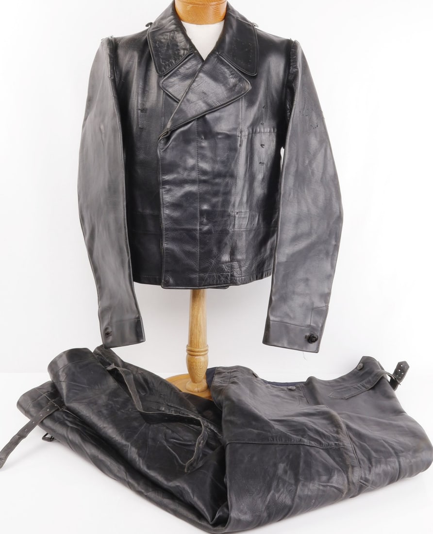 WWII GERMAN WAFFEN SS LEATHER PANZER WRAP & PANTS: WWII GERMAN WAFFEN SS LEATHER PANZER WRAP & PANTS In very good condition. Includes tunic & pants. Tailor's stamp on inner left side. No rips or tears present. shoulder to shoulder measures 15 inches. 