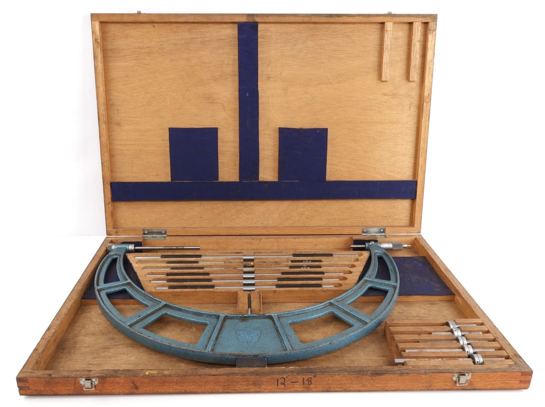 VINTAGE NSK 12-18 INCH INDUSTRIAL MICROMETER: NSK (Japan Precision Company) 12"-18" sliding anvil outside micrometer. Includes wood case with 6 interchangeable spindles and 6 anvils. Marked Lummus (major Texas petrochemical corporation) and calib
