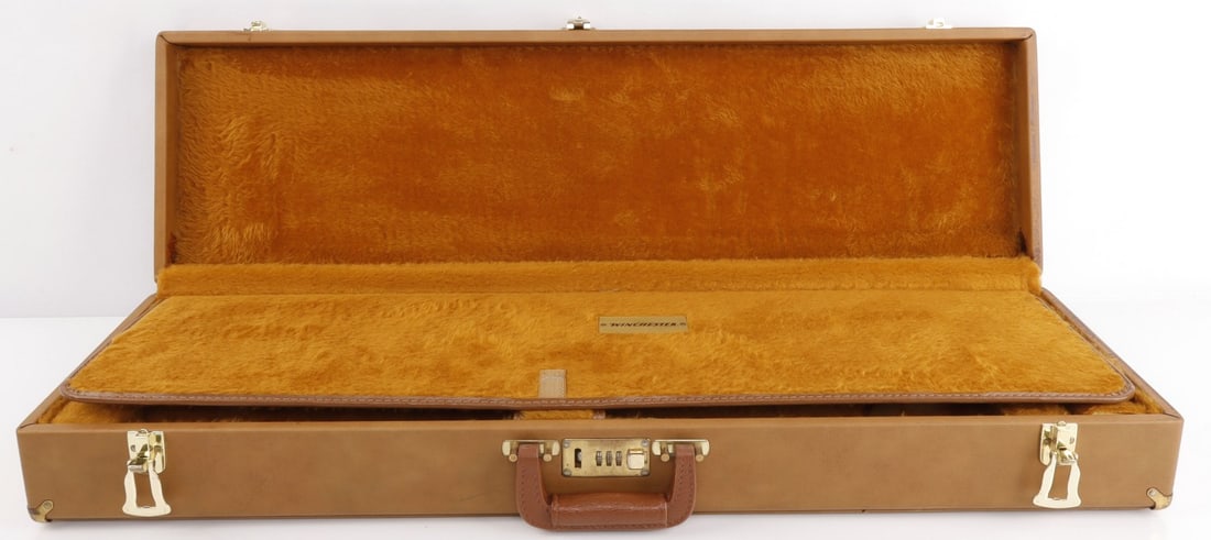 VINTAGE 1982 WINCHESTER MODEL 23 PIGEON GUN CASE: Vintage 1982 Winchester Rifle Case, includes 3 spaces within the case for storage, fur interior, and a safe code lock. Measures 33.75x9.5x5 inches. Slight wear, very good condition.